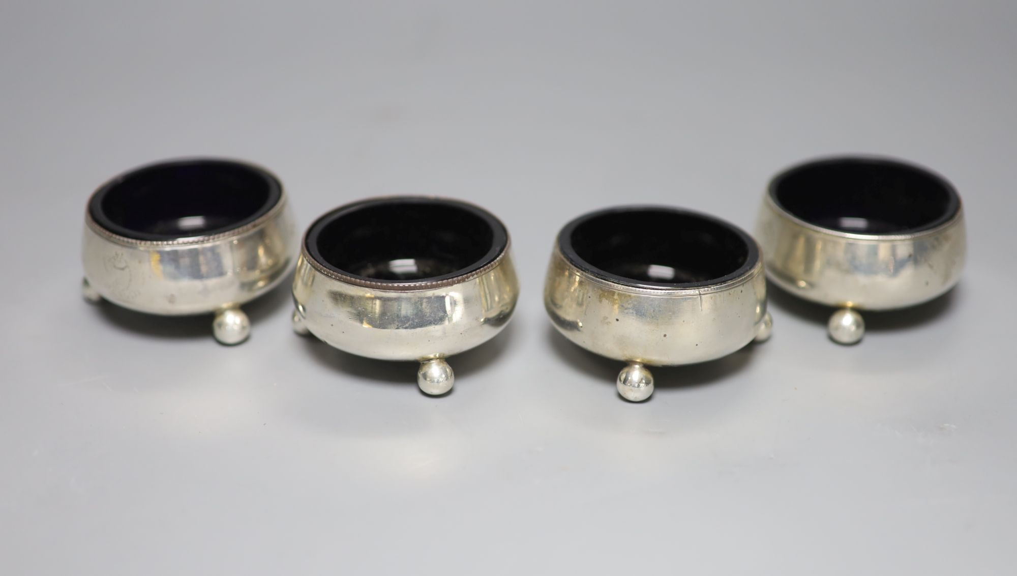 Two pairs of Victorian silver salts, on ball feet, Sheffield, 1870 and London, 1873, approx. 62mm.